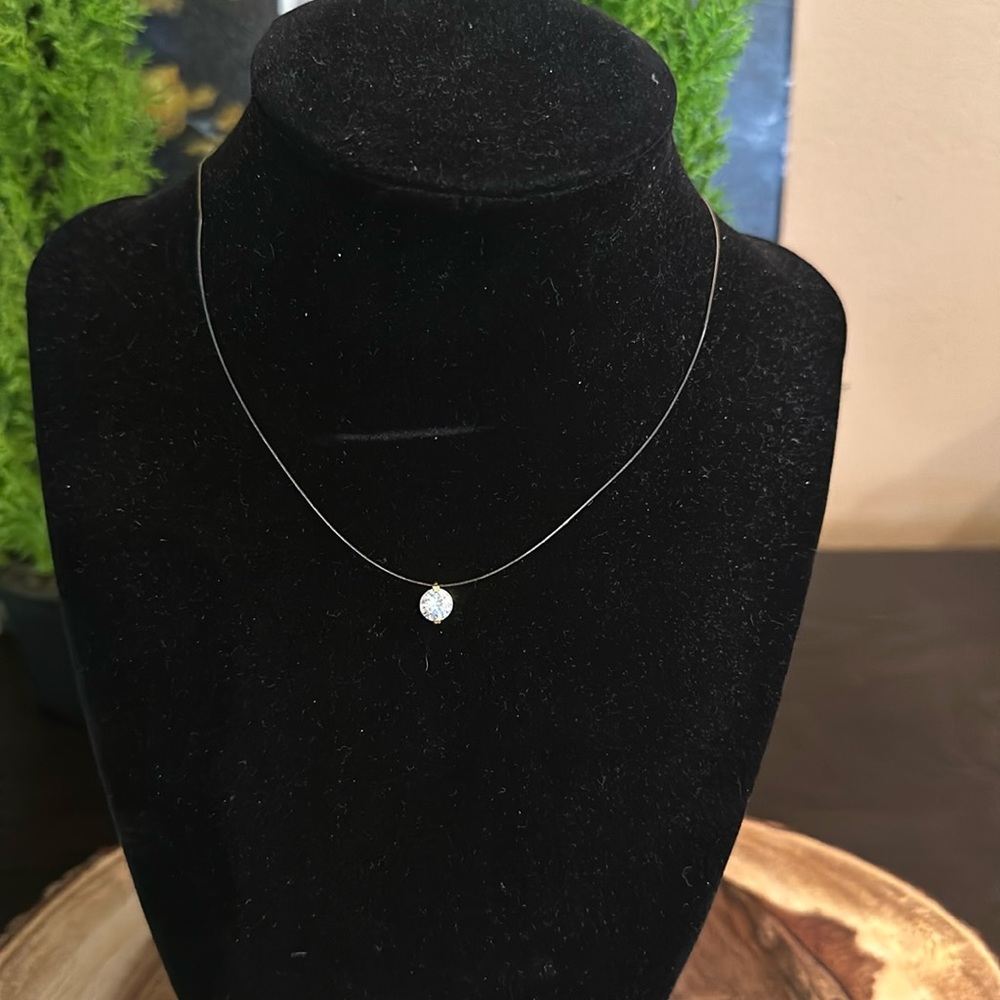 14 karat gold with CZ stone, suspended necklace